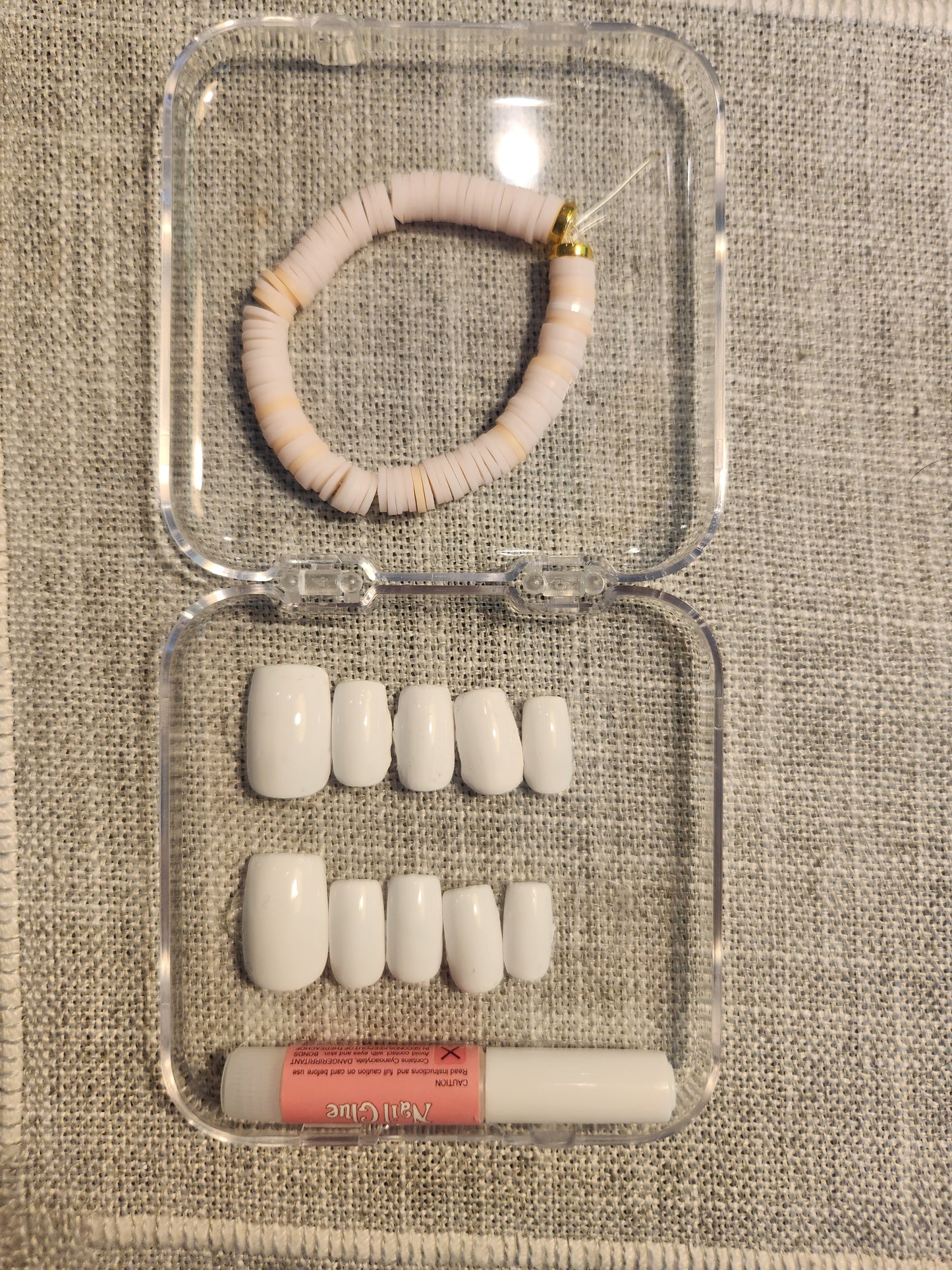 White nail set with matching off white bracelet