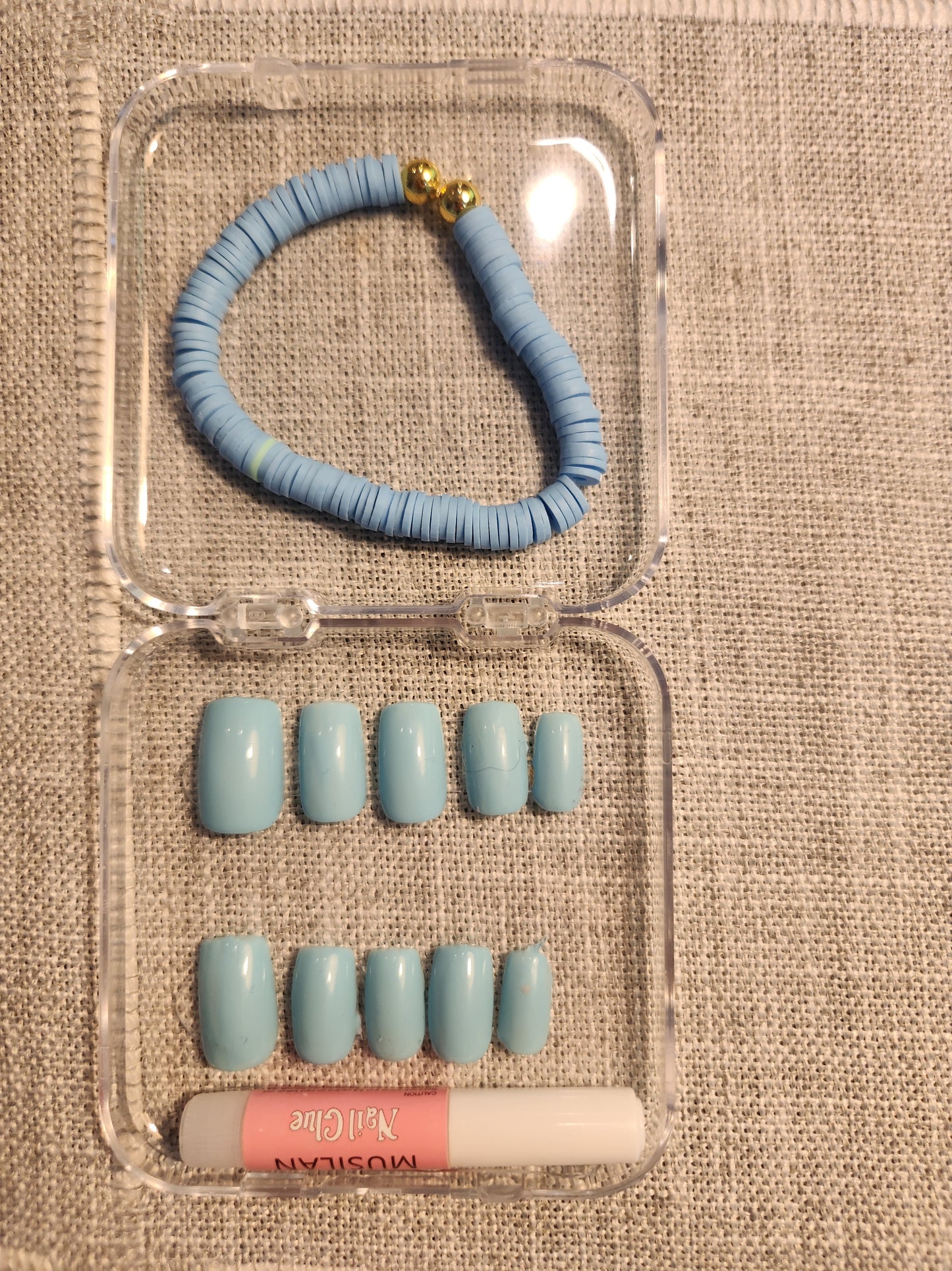 Baby blue nails with matching blue clay bracelets