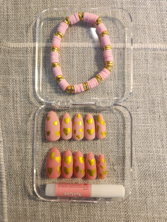 Pink and gold nail set with matching pink and gold bracelet